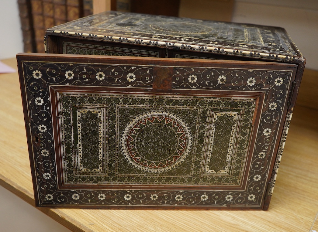 An early 17th century Indo-Portuguese ivory inlaid table cabinet, Gujarat, 29cm high. Condition - poor, losses CITES Submission reference 3XBFQXPT